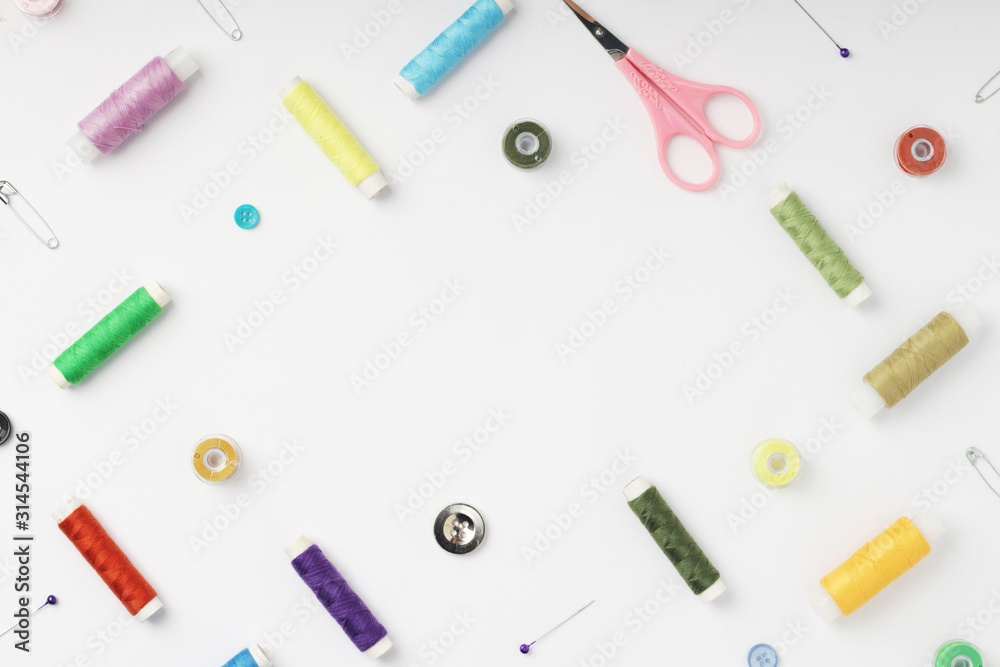 White background with different tools for sewing and tailoring White background with different tools for sewing and tailoring