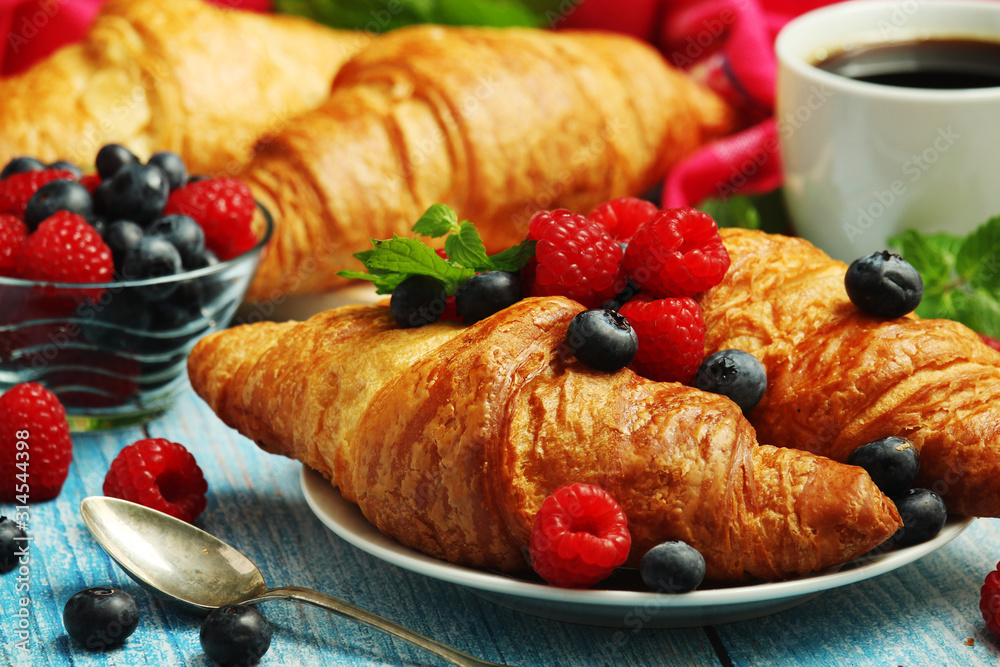 Croissants with fresh berries for breakfast Croissants with fresh berries for breakfast