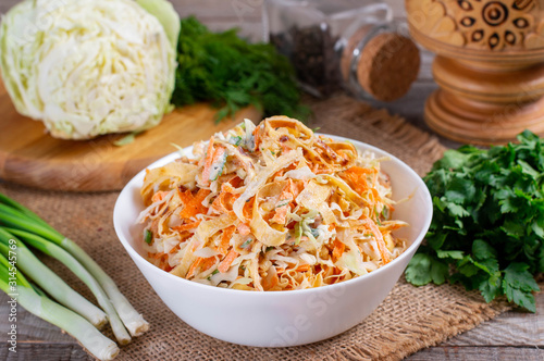 A bowl of cabbage and carrot salad