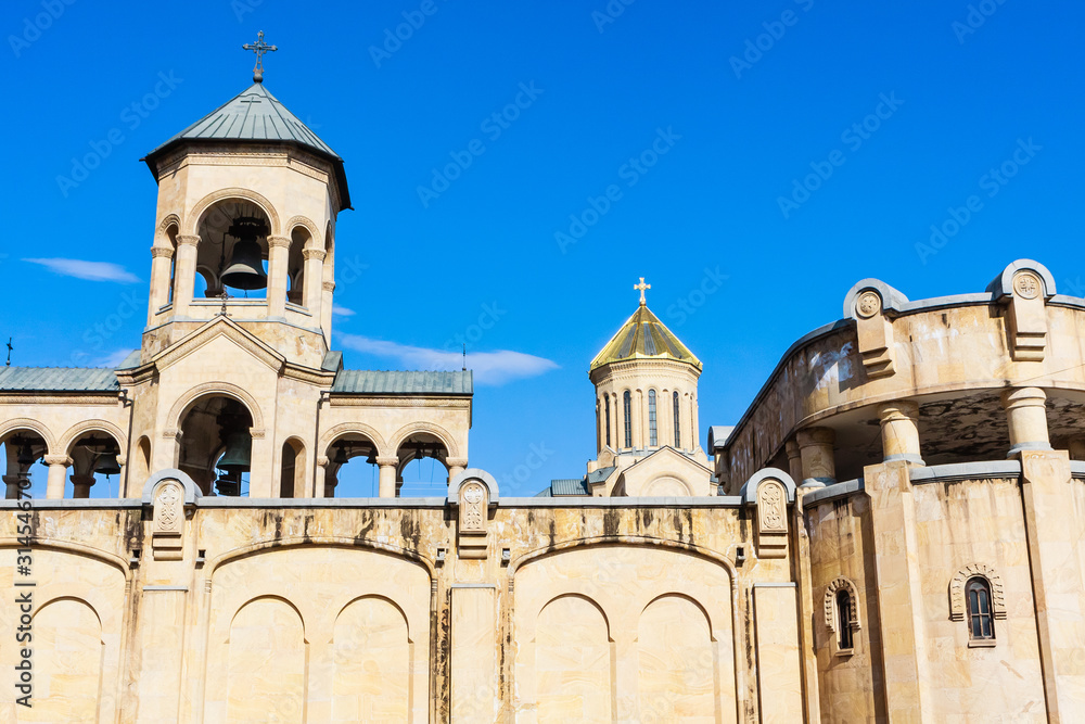 Fragment of  chapel and Sameba Cathedral Tsminda in Tbilisi (Holy Trinity). Biggest church Orthodox in Caucasus Georgia region in a sunny day. The main cathedral of the Georgian Orthodoxy