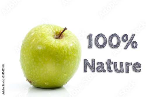100% Nature words written on isolated background with fresh green apple