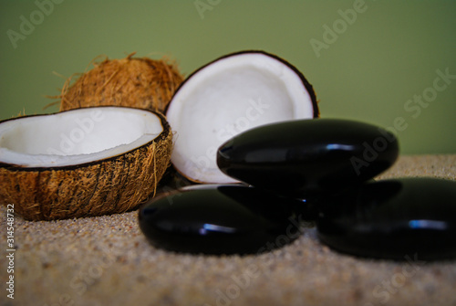 coconut  massage  sand  oil  coconut oil  obsidian  rocks  hot stones  alternative therapies  relaxation  meditation  decoration  interior  fruits  sea  beach  bottle  glass 