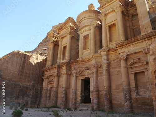 side view of famous Al Deir Monastery in the ancient city of Petra, Jordan, Middle East. One of new Seven Wonders of the World.