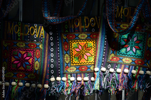 Moldovian colorful bags hanging on the sunlight at the market