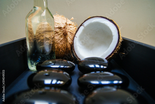 coconut, massage, sand, oil, coconut oil, obsidian, rocks, hot stones, alternative therapies, relaxation, meditation, decoration, interior, fruits, sea, beach, bottle, glass,