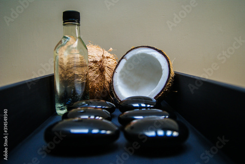 coconut, massage, sand, oil, coconut oil, obsidian, rocks, hot stones, alternative therapies, relaxation, meditation, decoration, interior, fruits, sea, beach, bottle, glass,