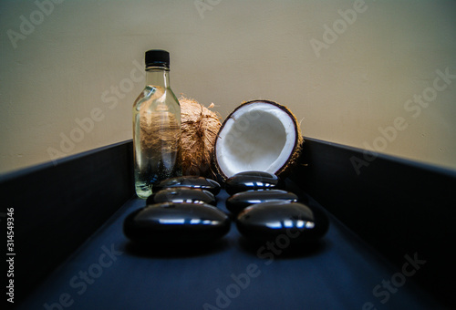 coconut, massage, sand, oil, coconut oil, obsidian, rocks, hot stones, alternative therapies, relaxation, meditation, decoration, interior, fruits, sea, beach, bottle, glass,