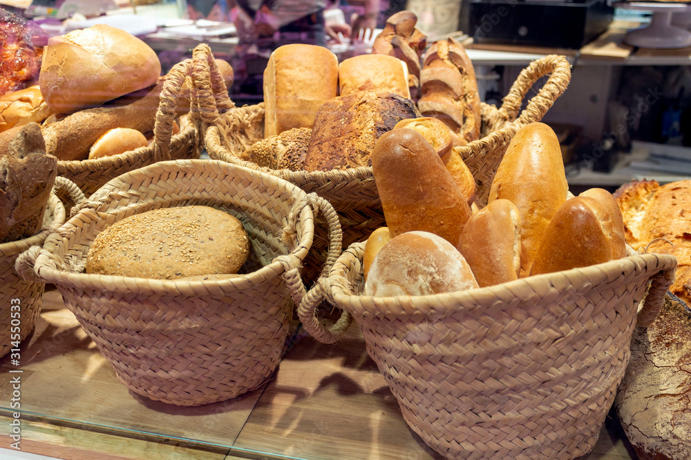 freshly baked bread in large baskets at a market stall