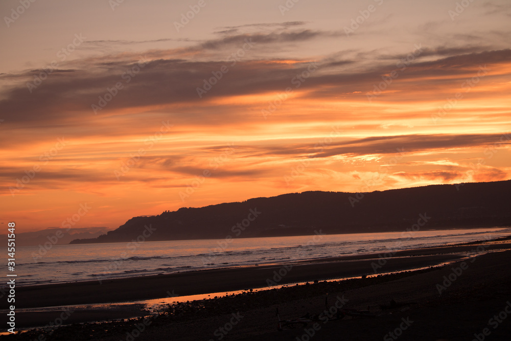 Colorful summer sunset over the beach and bluffs – Homer, Alaska