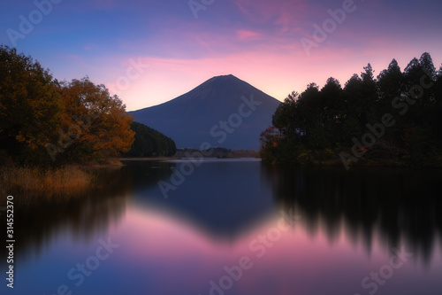 Beautiful landscape view of Mt. Fuji with reflection at Tanuki lake in Fujinomiya, Shizuoka, Japan photo