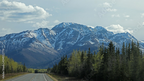 Alaska Highway with Nutzotin Mountains in the background - Alaska
