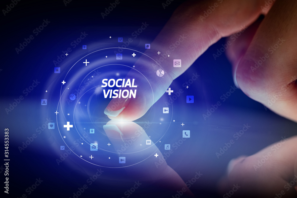 Finger touching tablet with social media icons and SOCIAL VISION