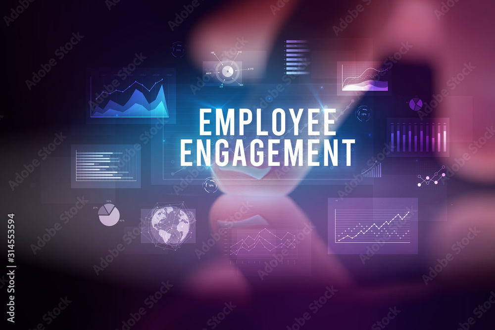 Finger touching tablet with charts and EMPLOYEE ENGAGEMENT inscription, business concept Finger touching tablet with charts and EMPLOYEE ENGAGEMENT inscription, business concept
