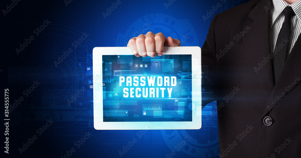 Young business person working on tablet and shows the digital sign: PASSWORD SECURITY Young business person working on tablet and shows the digital sign: PASSWORD SECURITY