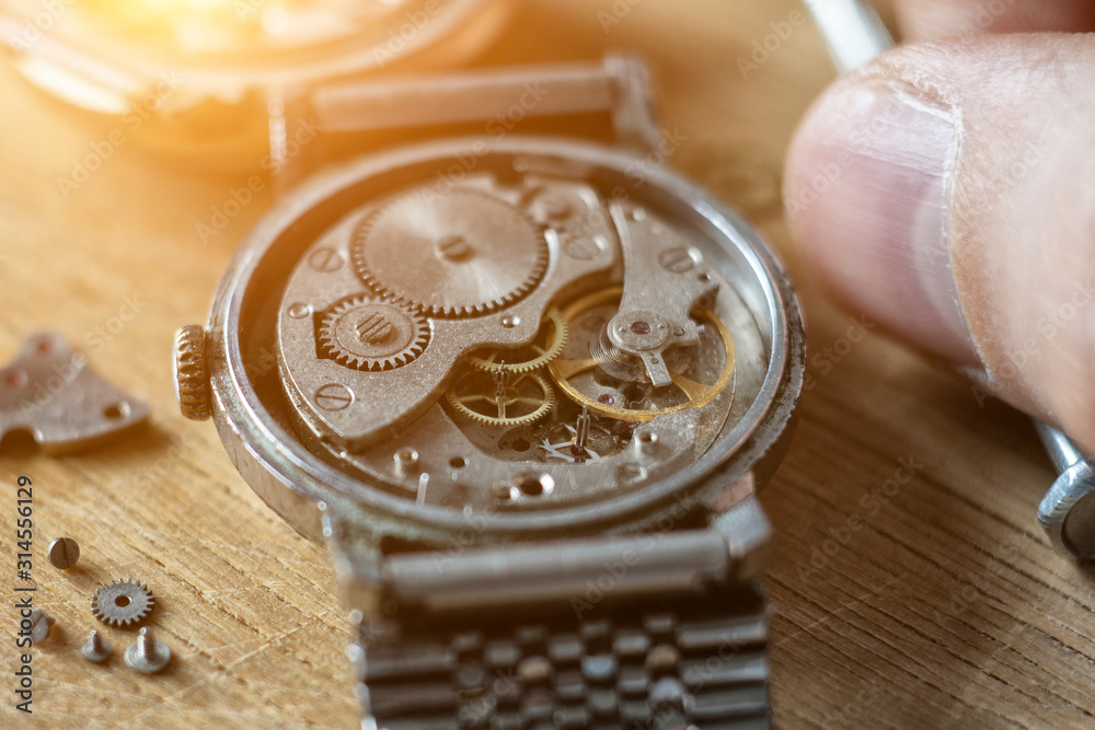 Watchmaker is repairing the wristwatch, mechanical watch Watchmaker is repairing the wristwatch, mechanical watch