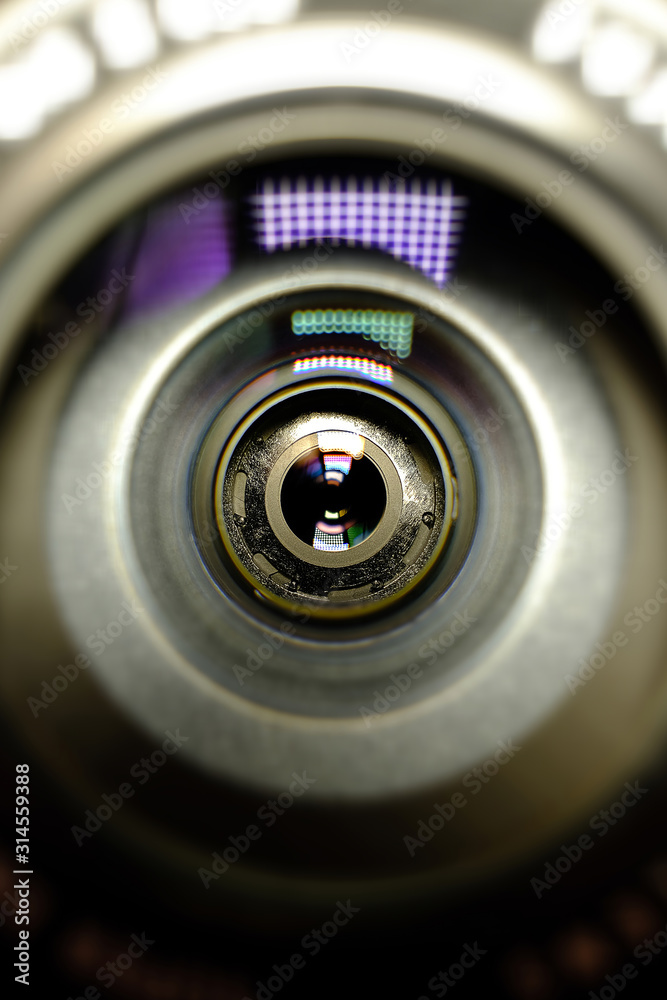 Conceptual design business card of the photographer.Camera lens in the background for conceptual design. Dark background. Technological concept. Business concept. Conceptual design business card of the photographer.Camera lens in the background for conceptual design. Dark background. Technological concept. Business concept.