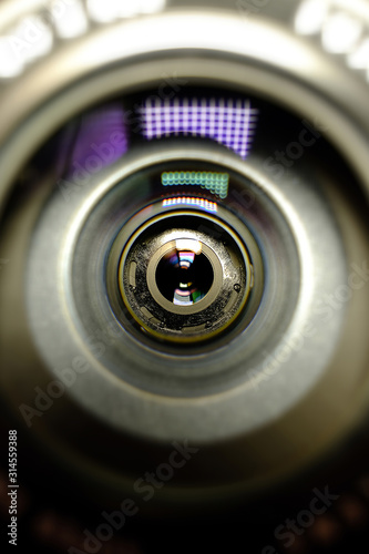 Conceptual design business card of the photographer.Camera lens in the background for conceptual design. Dark background. Technological concept. Business concept.