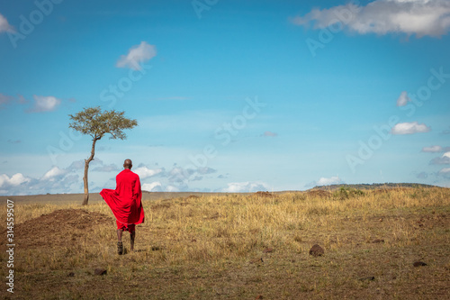 Maasai Tribe Man Walking Away in Kenya Africa photo