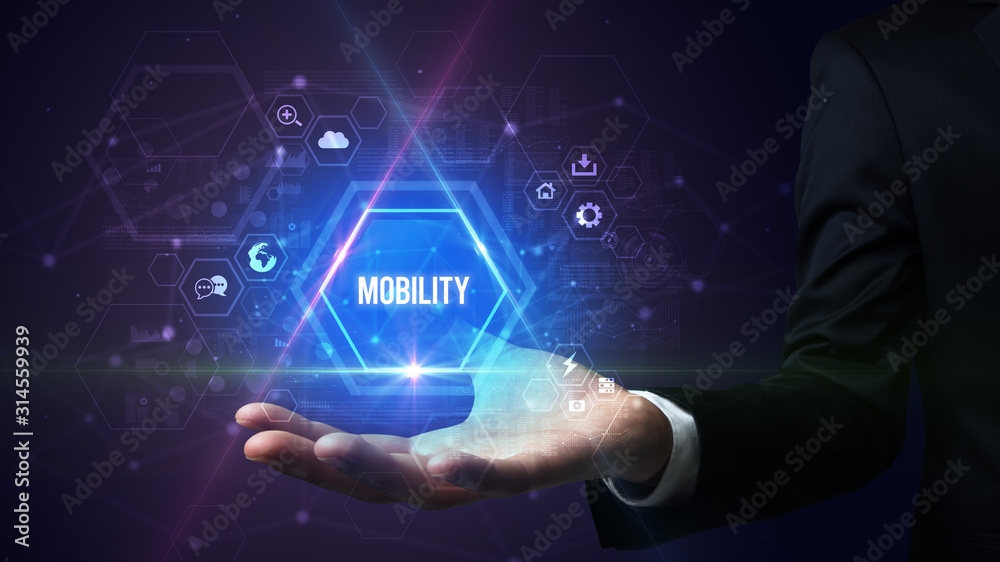 Obraz premium Man hand holding MOBILITY inscription, social media concept
