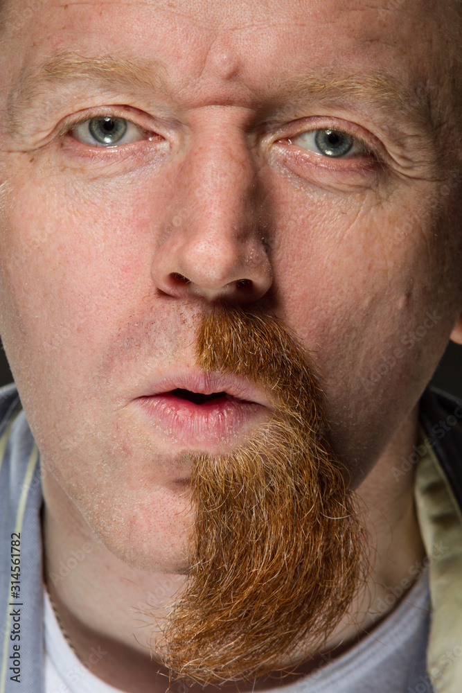 Obraz premium man with half red beard