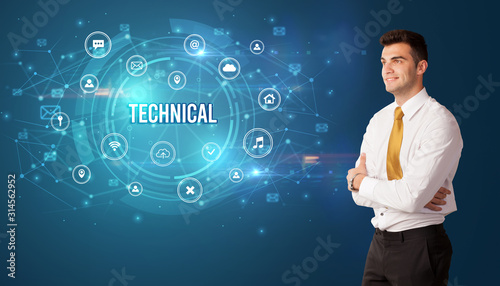 Businessman thinking in front of technology related icons and TECHNICAL inscription, modern technology concept