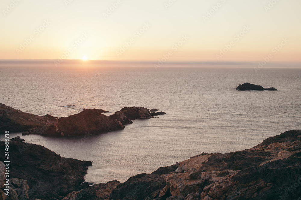 sea bay with rocks at sunrise
