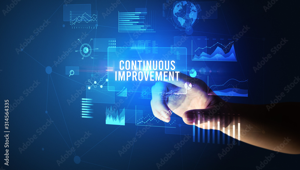 Hand touching CONTINUOUS IMPROVEMENT inscription, new business technology concept Hand touching CONTINUOUS IMPROVEMENT inscription, new business technology concept