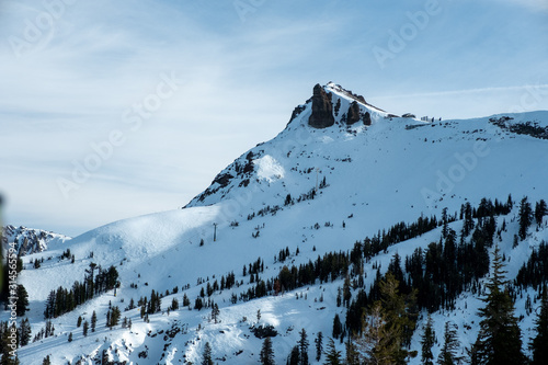 Lift going to the top of a mountain in the distance photo