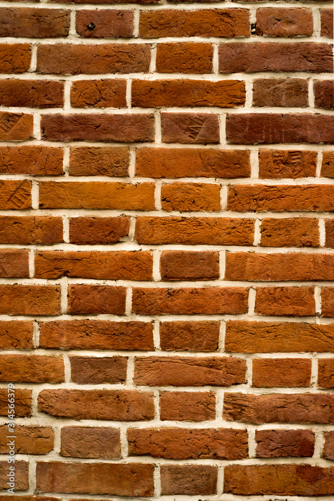 Obraz premium brick red wall and house background. brick house.