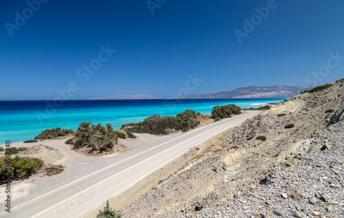 Gravel   pebble beach at the southwest coast of Rhodes island near Apolakkia with multi colored ocean water