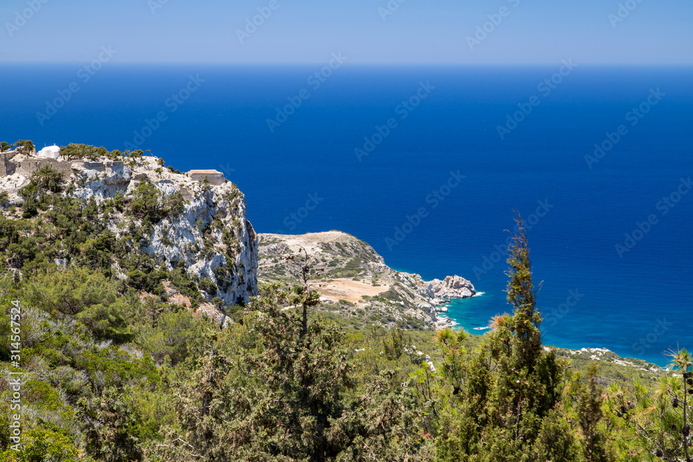 Scenic view at landscape and rocky coastline near Monolithos on Greek island Rhodes with the aegaen sea in the background