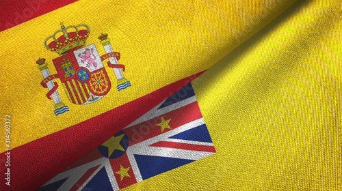 Spain and Niue two flags textile cloth, fabric texture photo