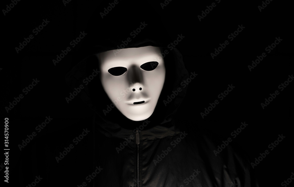 Scary white mask in the dark. Spooky guy in black jacket and white  masquerade. Black, invisible eyes. Halloween style. Stock Photo | Adobe  Stock