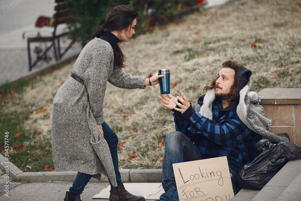 Homeless In A City Man Asking For Food Man With A Tablet Girl Homeless In A City Man Asking For Food Man With A Tablet Girl