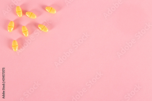 Medicine pills on pink background © diegorayaces