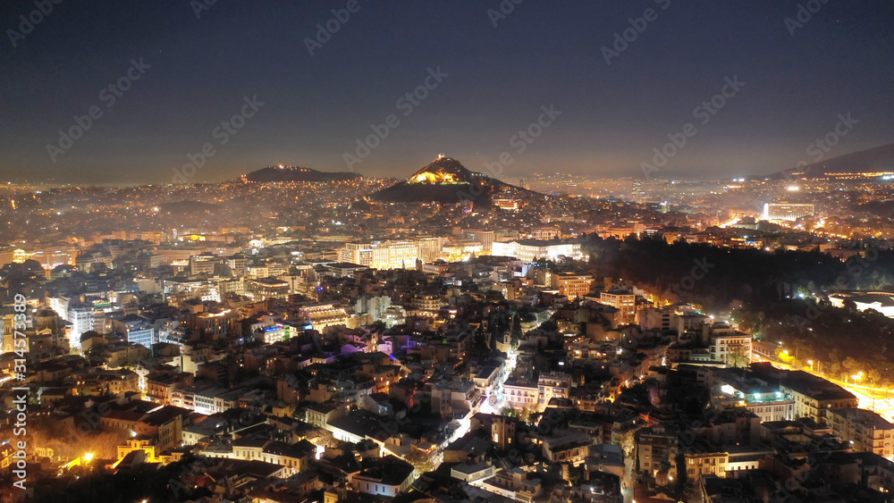 Aerial drone night shot of illuminated cityscape of Athens, Attica, Greece