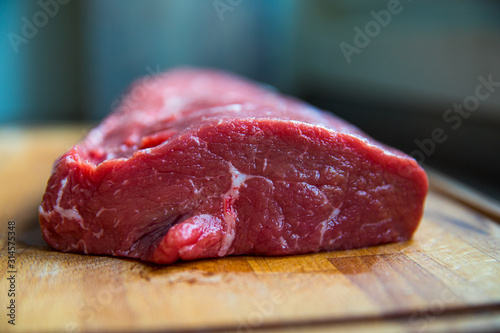 Raw beef, beef steak on a wooden table top