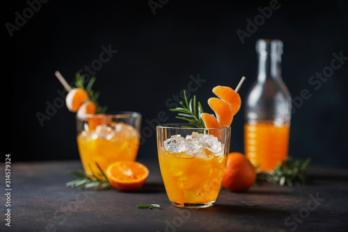 Alcoholic cocktail with mandarins
