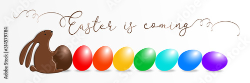 Happy Easter greeting card with chocolate bunny and color eggs fall by chain reaction, domino effect on white background. Rabbit candy and holiday type font - Easter is coming. Vector illustration