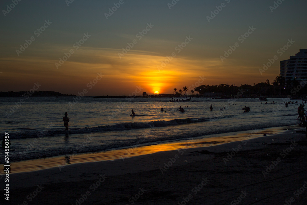 People swimming in sunset 2