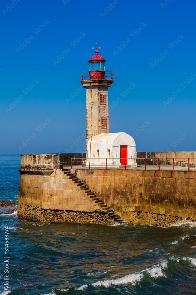 Beautiful early spring day at the historical Felgueiras Lighthouse built on 1886 and located at Douro river mouth in Porto city