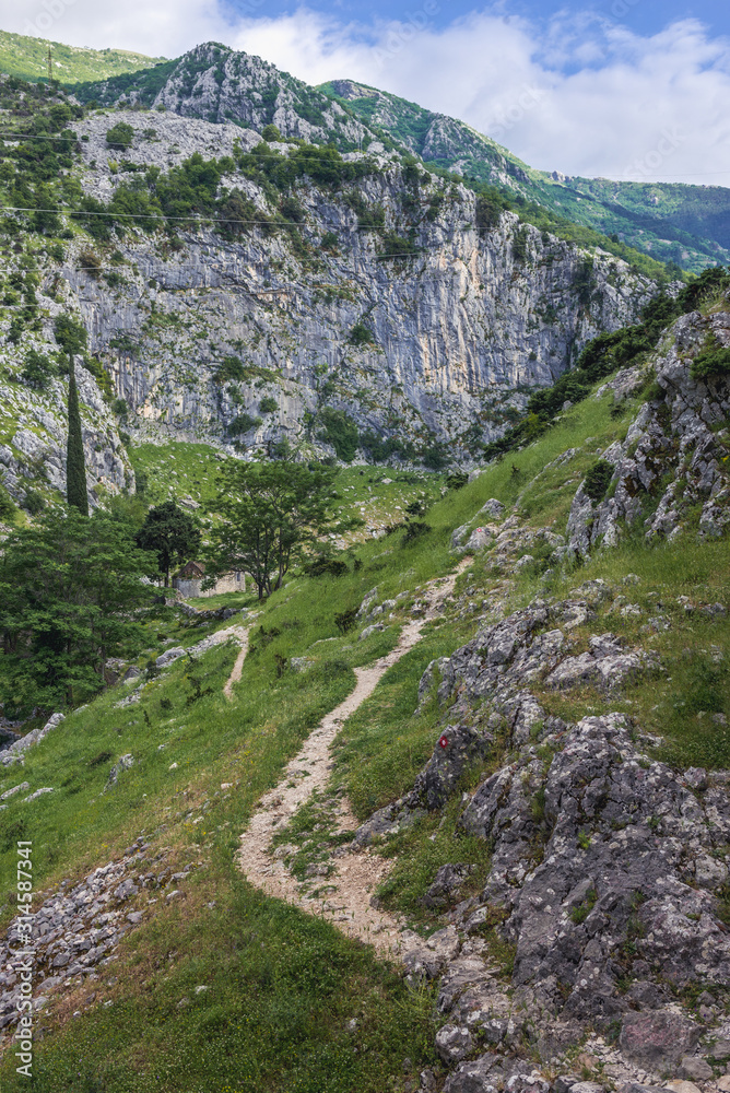 Footpath next to ruins of St John fort leads to small chapel of St John in the oldest part of Kotor, Montenegro Footpath next to ruins of St John fort leads to small chapel of St John in the oldest part of Kotor, Montenegro