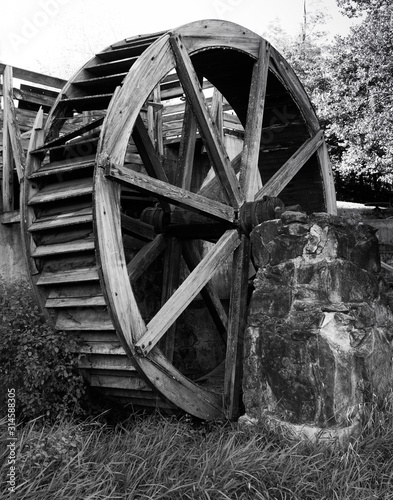Waterwheel on roller mill (gristmill) state historic site along the banks of the big raccoon creek built in Parke County in Mansfield, Indiana built in 1875