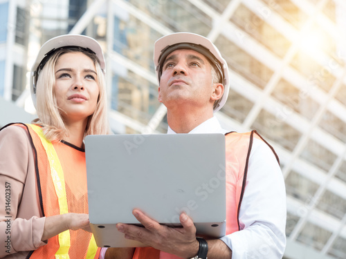 Chief Engineer, Chief Architect female and Executive Investor businessman View Report Construction of Mega Project manufactoring  Investment fectory industry Research Digital Technology Research photo