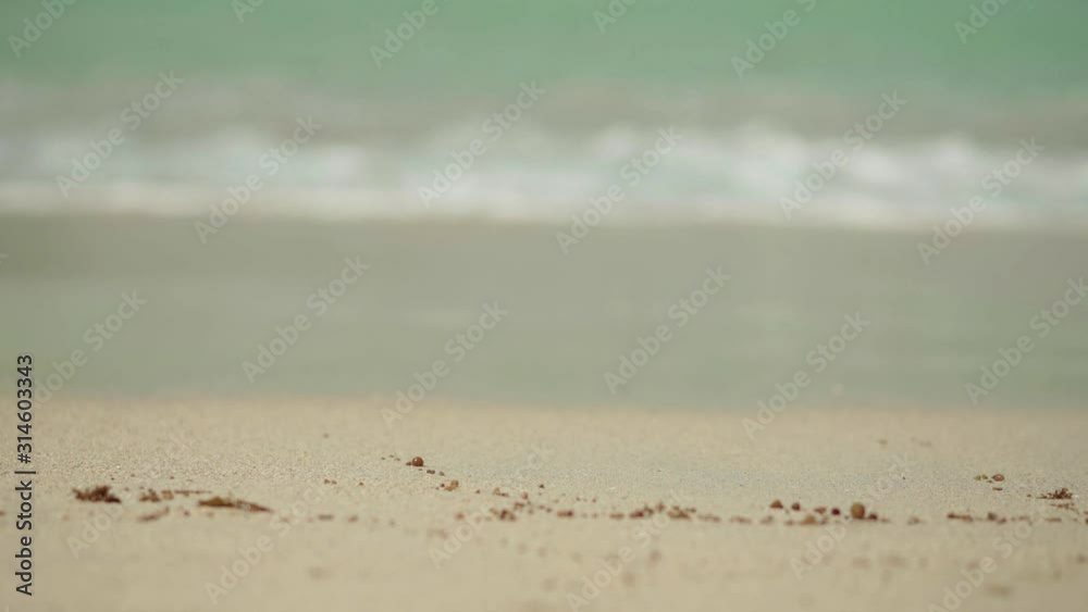 El Nido, Philippines - Waves Splashing On The Sandy Shore Of The Sea On A Sunny Day - Closeup Shot El Nido, Philippines - Waves Splashing On The Sandy Shore Of The Sea On A Sunny Day - Closeup Shot