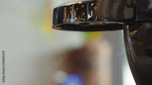 El Nido, Philippines - Cleaning Of Coffee Filter With Hot Water From The Coffee Making Machine - Closeup Shot photo