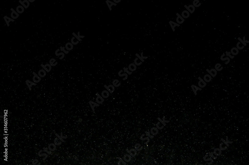 granules sparkling on a dark background ,selective focus