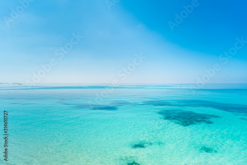 Maldives Island sea White sand Blue sky beautiful summer tropical ocean beach © NOBIKLAB