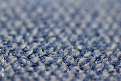 Defocused macro abstract texture background of a vintage worn blue color cloth towel © Cynthia