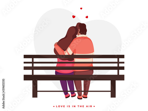 Back View of Loving Couple Hugging Sit on Bench for Love is in the air concept.